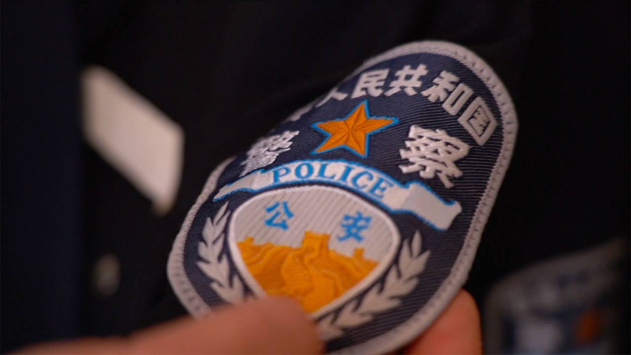 Wang Leizhang shows his old police uniform. The whistleblower reports about torture and forced labor in Xinjiang