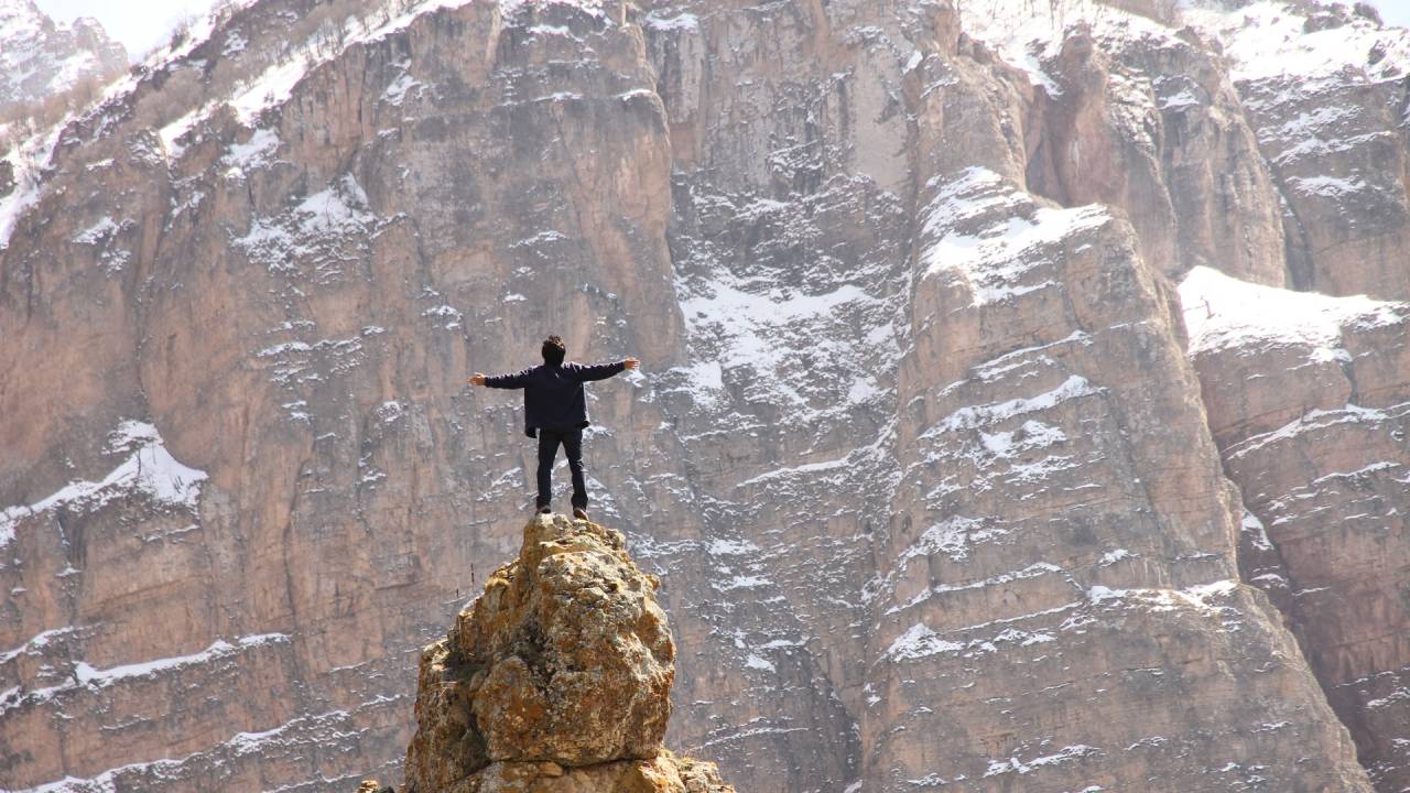 man standing on mountain