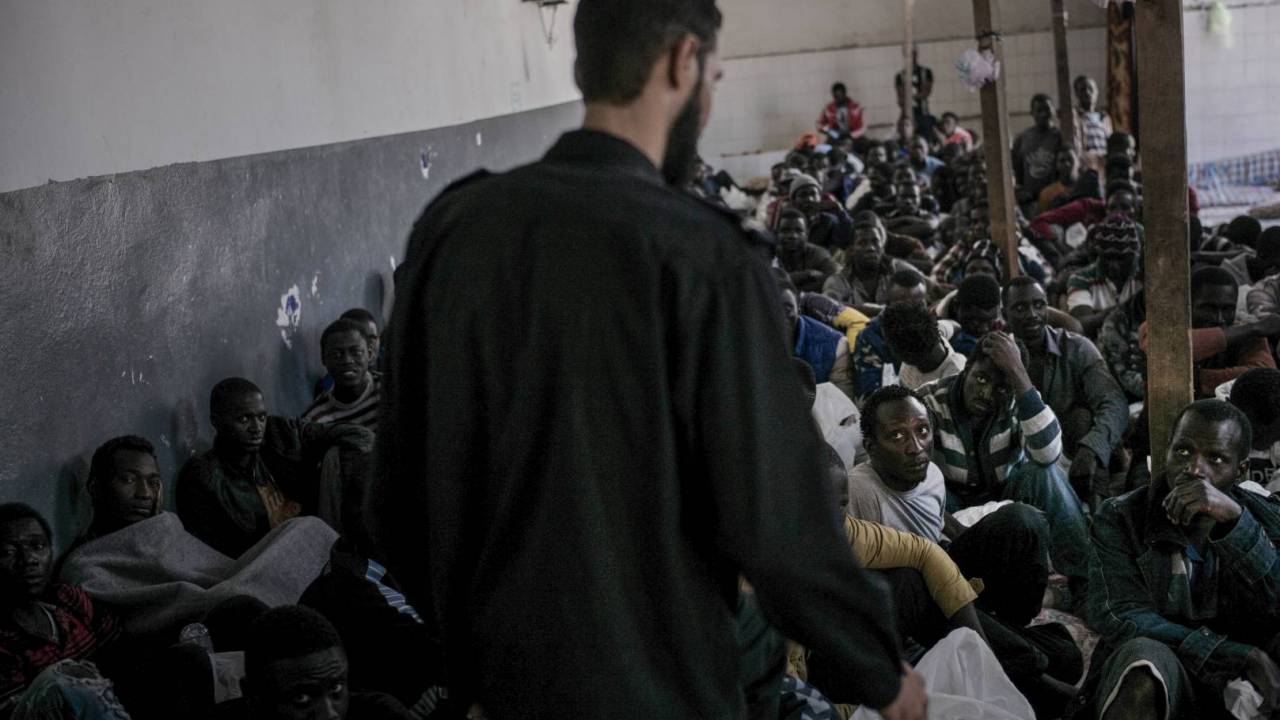 A group of migrants inin a detention centre in Libya.