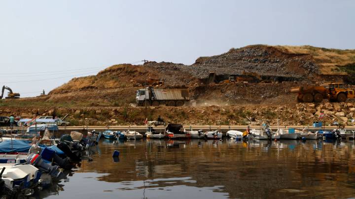 A truck hauls waste at the Bourj Hammoud landfill site. Untreated waste is being dumped into the sea as a part of the land reclamation project.