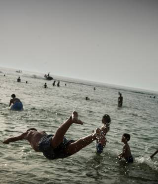 Libyans Enjoy Summer Swimming.